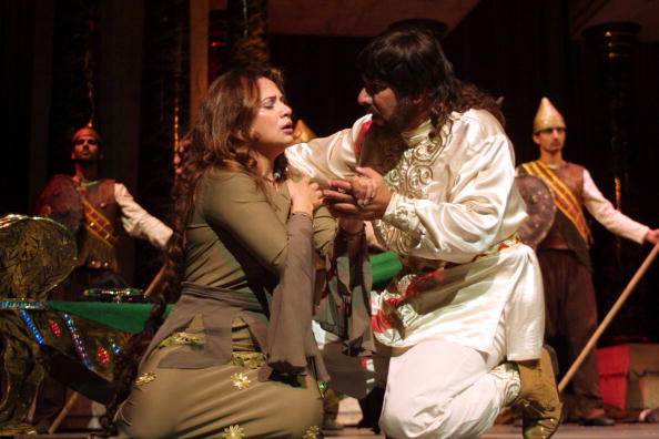 AMMAN, JORDAN - SEPTEMBER 10: Iraqi actors perform "Zabibah and the King," a play based on a novel written by Iraqi President Saddam Hussein, at the al-Hussein Culture Center September 10, 2002 in Amman, Jordan. The play is about a relationship between a king and a woman named Zabibah, symbolizing the "love affair" between Saddam and the Iraqi people. (Photo by Salah Malkawi/Getty Images)